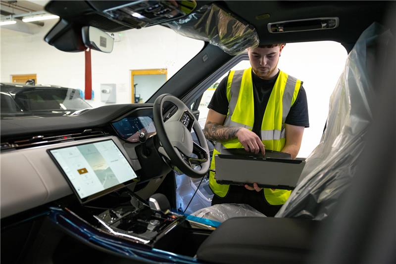 Engineer Fixing A Car